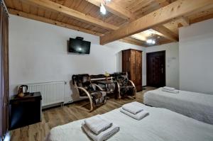 TV a/nebo společenská místnost v ubytování Magnat Inn Sauna & Relax