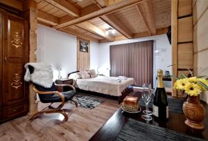 Postel nebo postele na pokoji v ubytování Magnat Inn Sauna & Relax