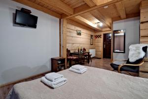 TV a/nebo společenská místnost v ubytování Magnat Inn Sauna & Relax