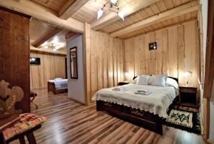 Postel nebo postele na pokoji v ubytování Magnat Inn Sauna & Relax