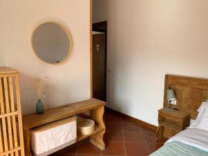 Rúm í herbergi á Enjoy Ledro B&B