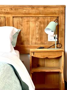 Rúm í herbergi á Enjoy Ledro B&B