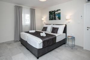 Postel nebo postele na pokoji v ubytování Villa Fig + 37 fotografií
