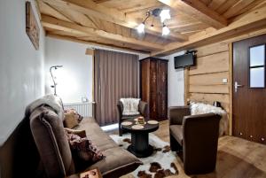 Posezení v ubytování Magnat Inn Sauna & Relax