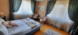 Postel nebo postele na pokoji v ubytování Infinity Boutique Apartments