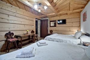 Postel nebo postele na pokoji v ubytování Magnat Inn Sauna & Relax