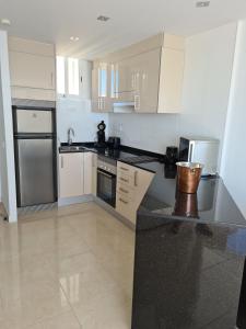 A kitchen or kitchenette at Room in Apartment - 1st line top floor apartment Még 7 kép