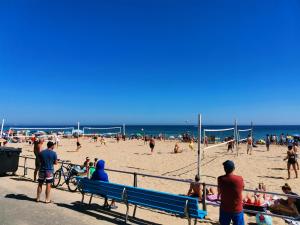 a group of people on the beach at the beach at Poseidon Friends in Bournemouth +17 photos