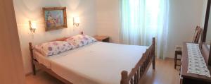 Postel nebo postele na pokoji v ubytování Apartments Josko Barbat