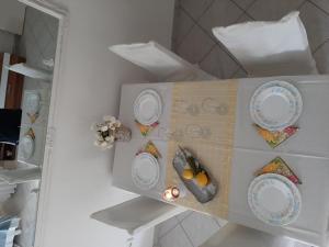 a shelf with plates on it in a kitchen at Apartments Edo in Vis