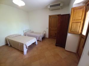 Katil atau katil-katil dalam bilik di Dormire al Casale