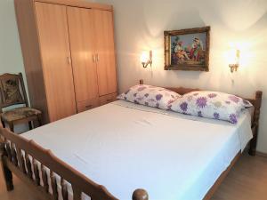 Postel nebo postele na pokoji v ubytování Apartments Josko Barbat