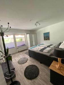 a bedroom with a large bed in a room at Evia Ferienwohnung in Heimbach