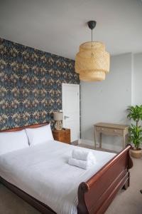 Ένα ή περισσότερα κρεβάτια σε δωμάτιο στο Rooms At The Rosebery