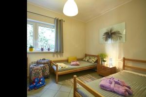 Posteľ alebo postele v izbe v ubytovaní Arenda Apartamenty&Domki całoroczne