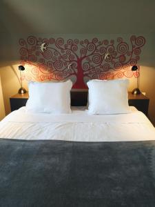 Postel nebo postele na pokoji v ubytování Hotel Lepelbed