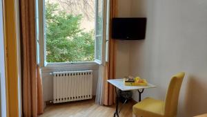 Televízia a/alebo spoločenská miestnosť v ubytovaní La Locandiera B&B