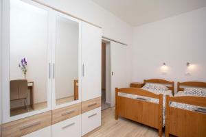 Postel nebo postele na pokoji v ubytování Apartmani Marica