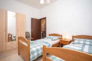 Postel nebo postele na pokoji v ubytování Apartmani Marica