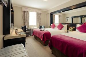 Cama ou camas em um quarto em Ashling Hotel Dublin