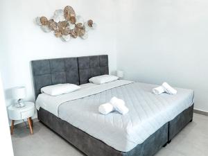 Cama ou camas em um quarto em Fabrica Sunset Apartments