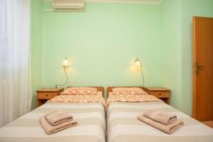 Postel nebo postele na pokoji v ubytování Apartmani Marica
