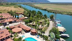 an aerial view of a resort next to a river at Portakal Hotel Dalyan in Dalyan