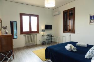 Televízia a/alebo spoločenská miestnosť v ubytovaní A Casa di Nonna Emma