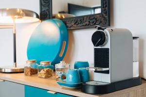 a coffee machine sitting on a shelf with food at Villa Magna - seaside villa with pool and sauna in Trogir