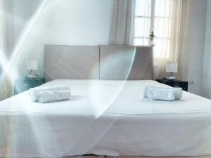 Cama ou camas em um quarto em Fabrica Sunset Apartments