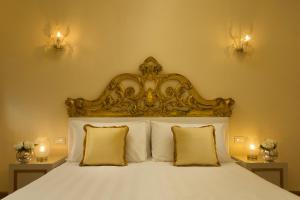 Postel nebo postele na pokoji v ubytování Relais Venezia