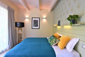 Letto o letti in una camera di L'ALBEROCASA