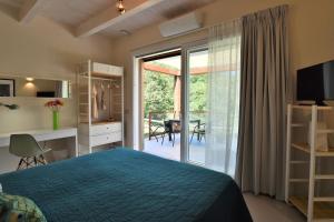 a bedroom with a bed and a sliding glass door at L'ALBEROCASA in Calenzano