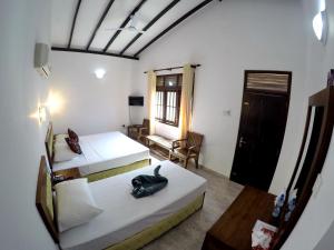 Ένα ή περισσότερα κρεβάτια σε δωμάτιο στο Ramon beach resort