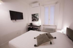 TV a/nebo společenská místnost v ubytování Ripagrande a Trastevere