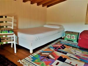 a bedroom with a bed, desk, and bookshelf at Podere Chiaromonte in Palaia