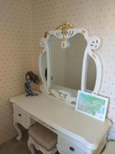 a white dressing table with a mirror on it at Апартаменты Талиана Бич курорта Елените in Elenite