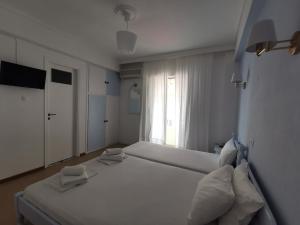 Postel nebo postele na pokoji v ubytování Hotel Rania