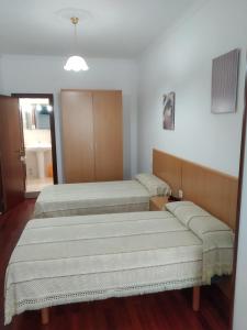 Postel nebo postele na pokoji v ubytování HOSTAL RESIDENCIA PRESIDENTE