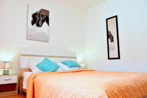 Posteľ alebo postele v izbe v ubytovaní Rooms Vilma close to Rab City
