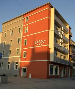 a building with a first sign on the side of it at Hotel Piast in Nysa