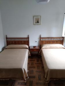 Postel nebo postele na pokoji v ubytování HOSTAL RESIDENCIA PRESIDENTE