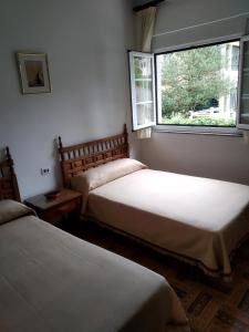 Postel nebo postele na pokoji v ubytování HOSTAL RESIDENCIA PRESIDENTE