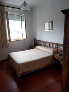 Postel nebo postele na pokoji v ubytování HOSTAL RESIDENCIA PRESIDENTE