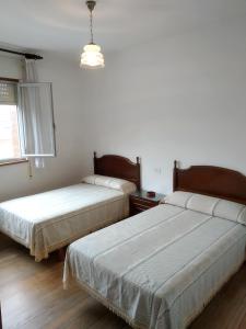 Postel nebo postele na pokoji v ubytování HOSTAL RESIDENCIA PRESIDENTE