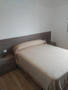 Postel nebo postele na pokoji v ubytování HOSTAL RESIDENCIA PRESIDENTE
