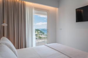 Postel nebo postele na pokoji v ubytování Ninemia Luxury Residence