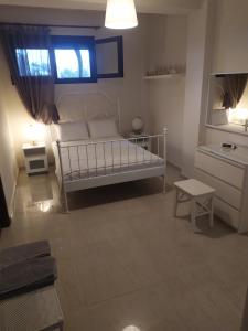 Postel nebo postele na pokoji v ubytování Afrodites sea view house