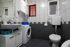 Kúpeľňa v ubytovaní Apartments Onorina