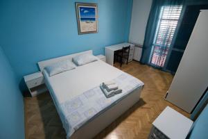Posteľ alebo postele v izbe v ubytovaní Apartments Onorina